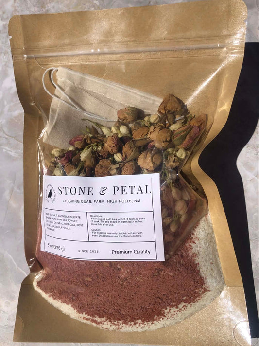Bag of dried flowers, herbs, and bath salts with a 'Stone & Petal' label.