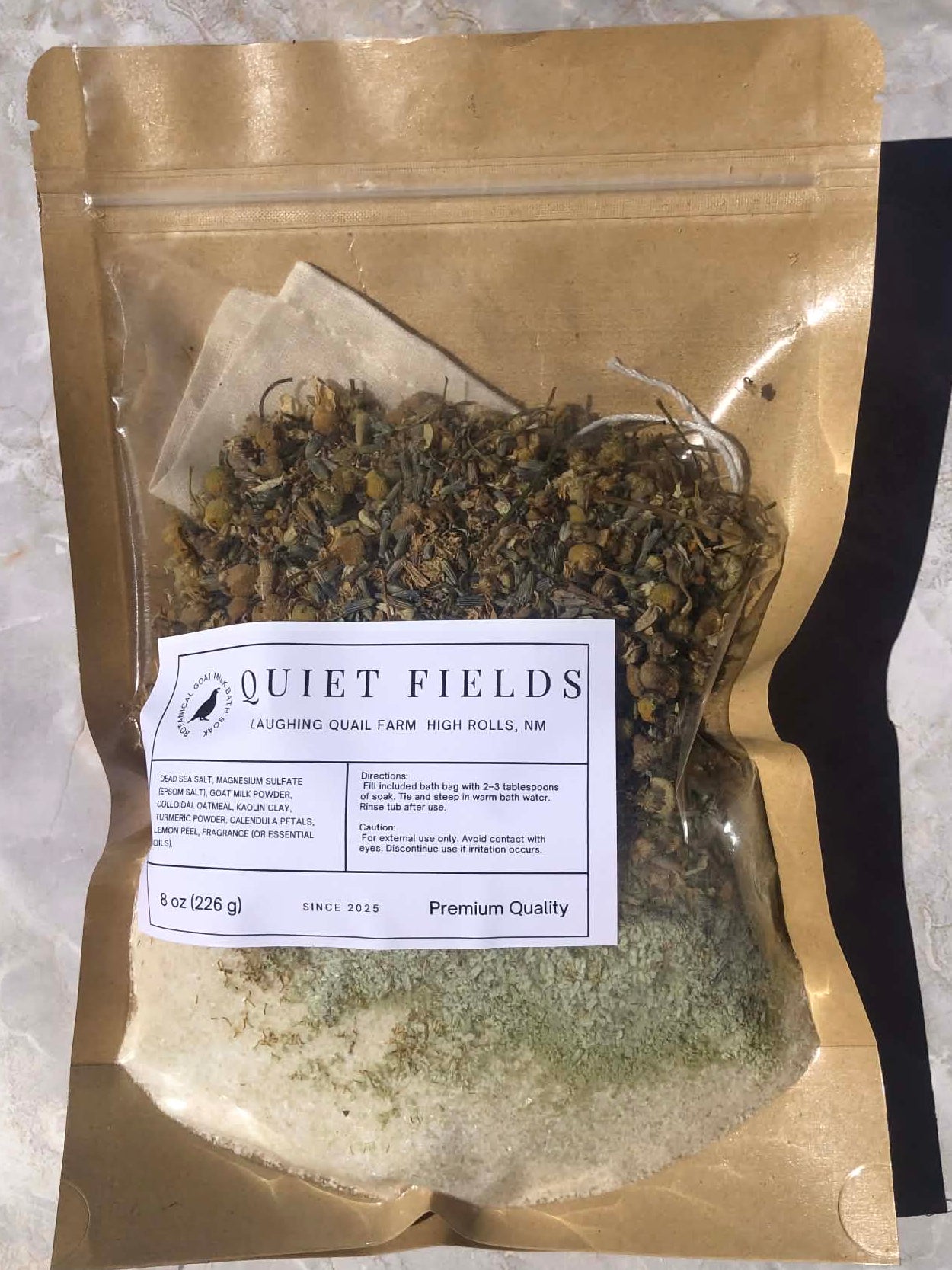 Package of dried herbs with 'Quiet Fields' label on a textured surface